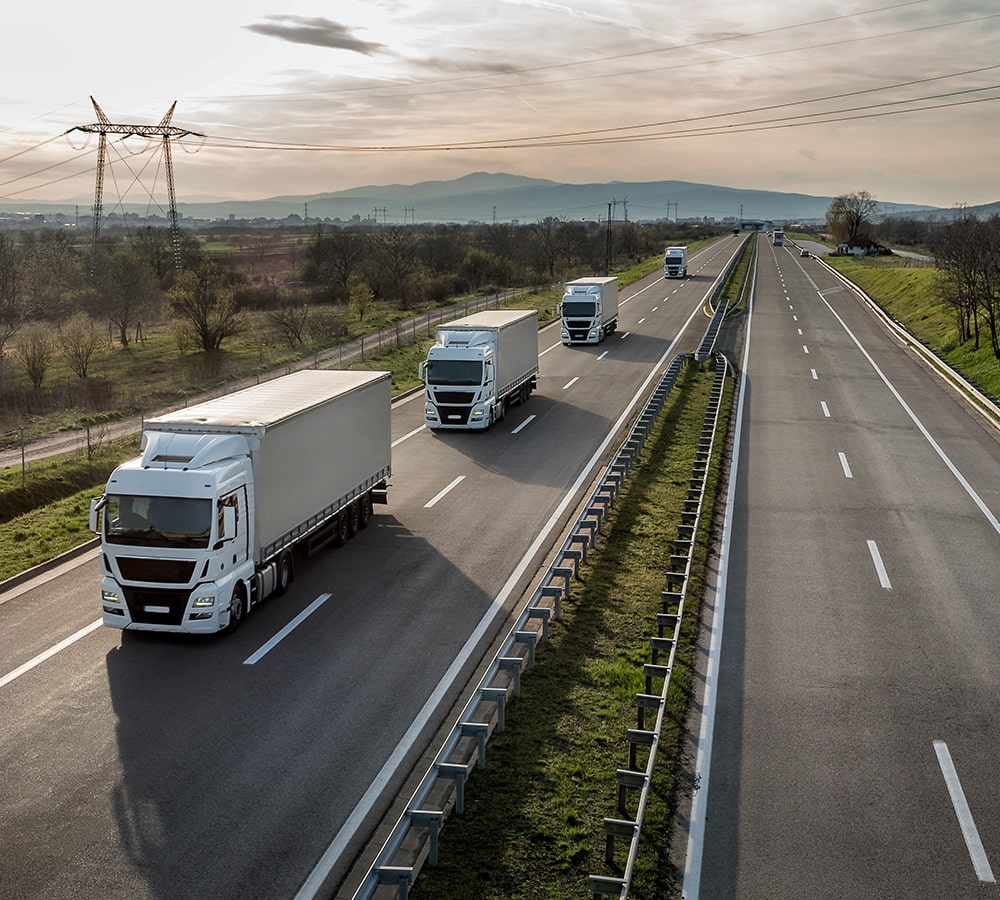 Highway with transport trucks